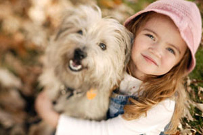 ca. 2003 --- Little Girl with Pet Terrier --- Image by © Edward Bock/CORBIS